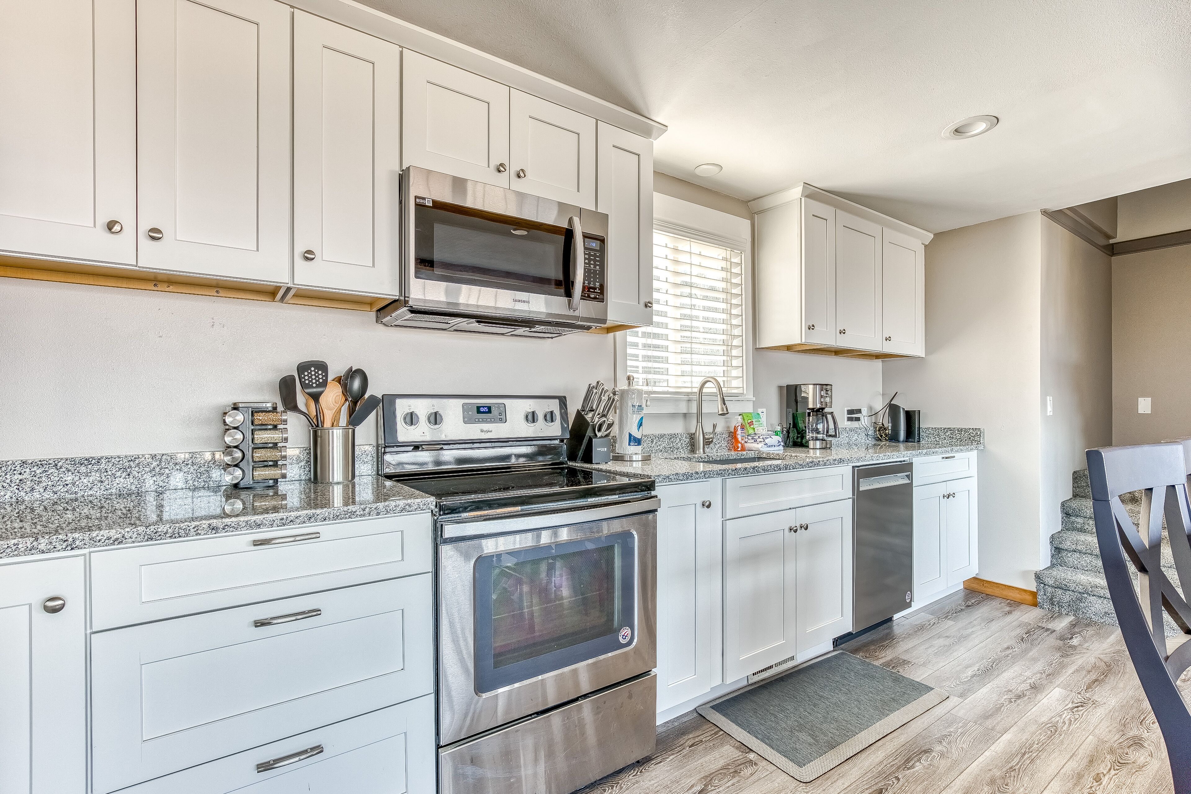 Dog-friendly home with ocean views, hot tub, deck, foosball, & fireplace