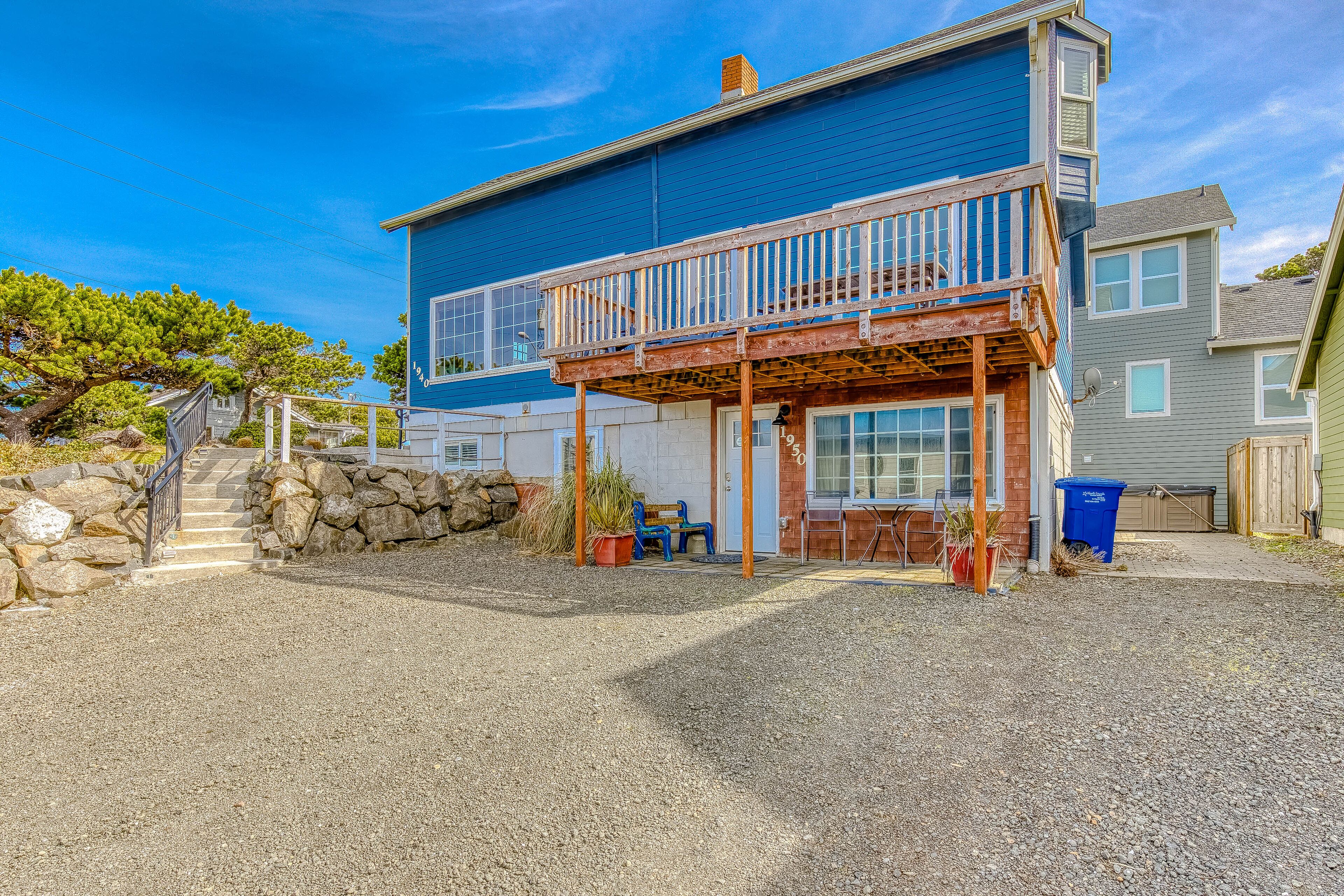 Dog-friendly home with ocean views, hot tub, deck, foosball, & fireplace