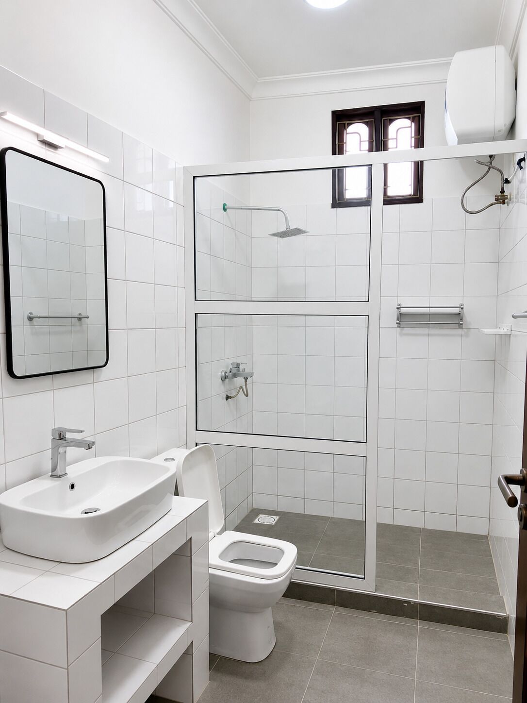 A modern bathroom with a sink, toilet, and glass-enclosed shower.