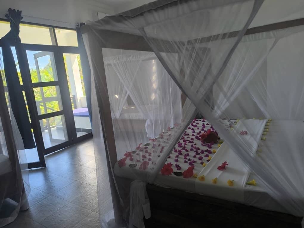 Triple Room - Garden View | Minibar, in-room safe, desk, laptop workspace