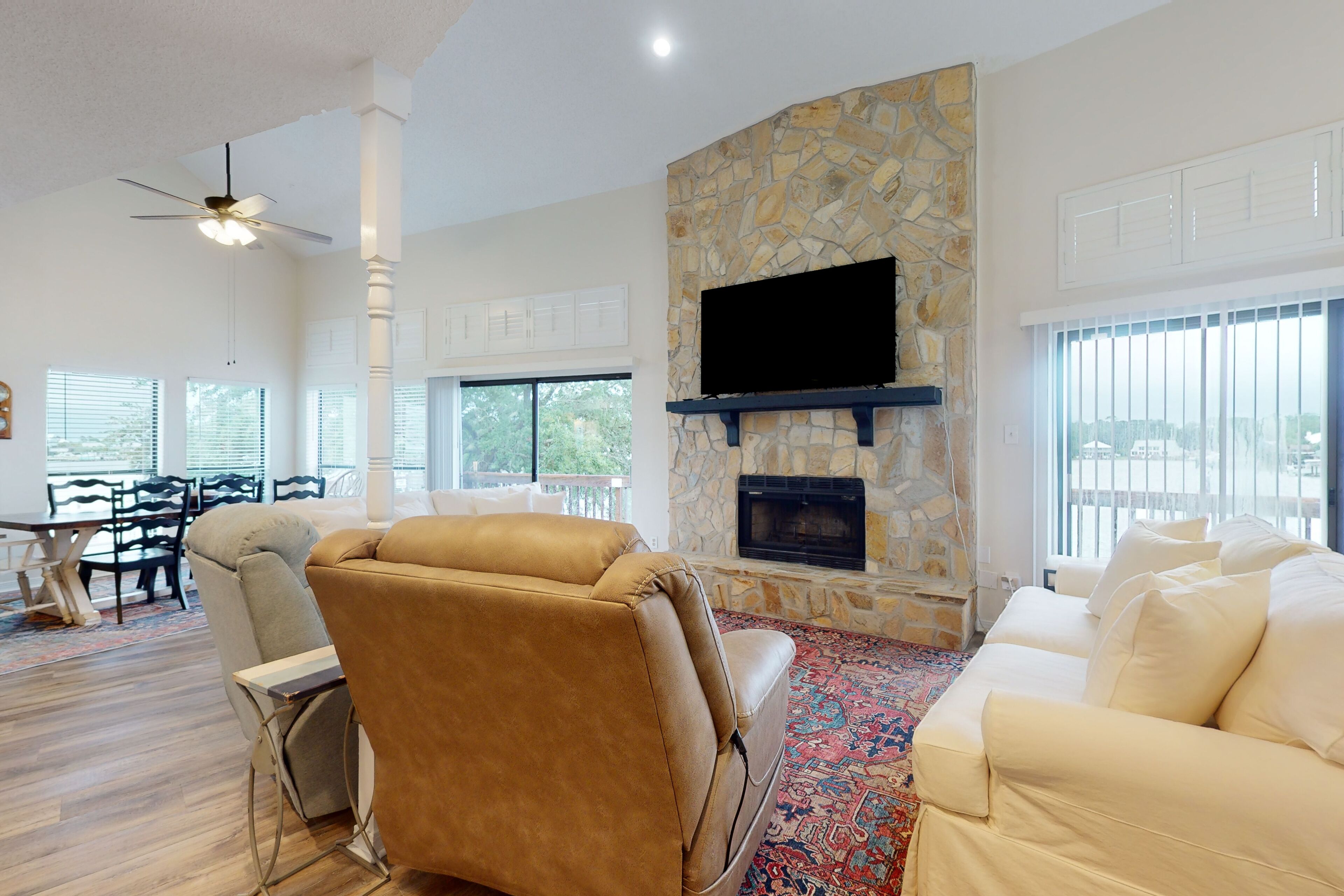 Bayfront home with boat dock, water views, deck, & fish cleaning station