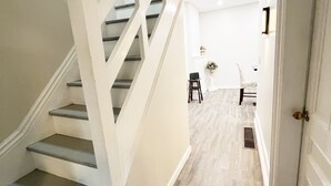A staircase with white railings and wooden steps leading to a landing. - Cottage W LAKE VIEWS, beside waterfront trail and steps from beach (Barrie)