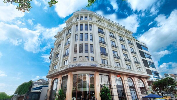 A multi-story hotel with a classic architectural style, featuring a prominent entrance with glass doors and a balcony. - Ciao SaiGon 2 Hotel (Ho Chi Minh City)