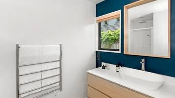 Shower, hair dryer, towels, shampoo