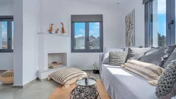 Family Apartment, Private Pool (Second Floor) | Living area | 50-inch Smart TV with satellite channels, TV
