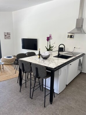 Family Apartment, Ground Floor | Private kitchen | Espresso maker, electric kettle, high chair - Mythos Luxury Villa-Skiathos (Skiathos)