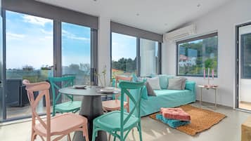 Family Apartment, Private Pool (Second Floor) | Living area | 50-inch Smart TV with satellite channels, TV