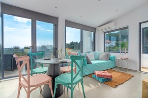 Family Apartment, Private Pool (Second Floor) | Living area | 50-inch Smart TV with satellite channels, TV