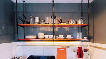 Toaster, cookware/dishes/utensils, dining tables