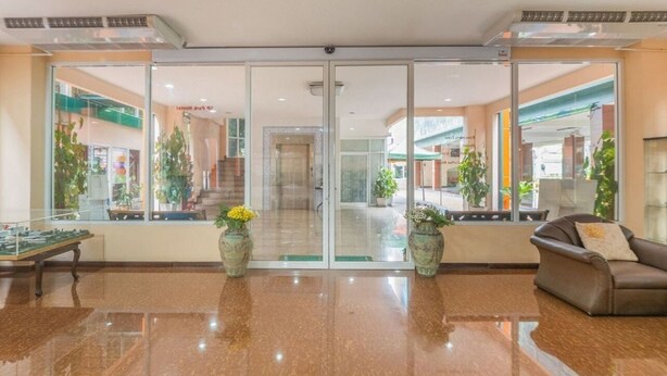 A spacious lobby with a polished floor, a billiards table, and potted plants. - MRT Thaphra spthaphra (Bangkok)