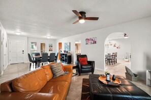 TV, offices - This spacious home has all you need with 2 primary suites, 2 guest bedrooms, and 3 bathrooms. There is no shortage of living space with a living room, 2 dining rooms, open floor plan w/fully-stocked kitchen, and onsite laundry. (El Paso)