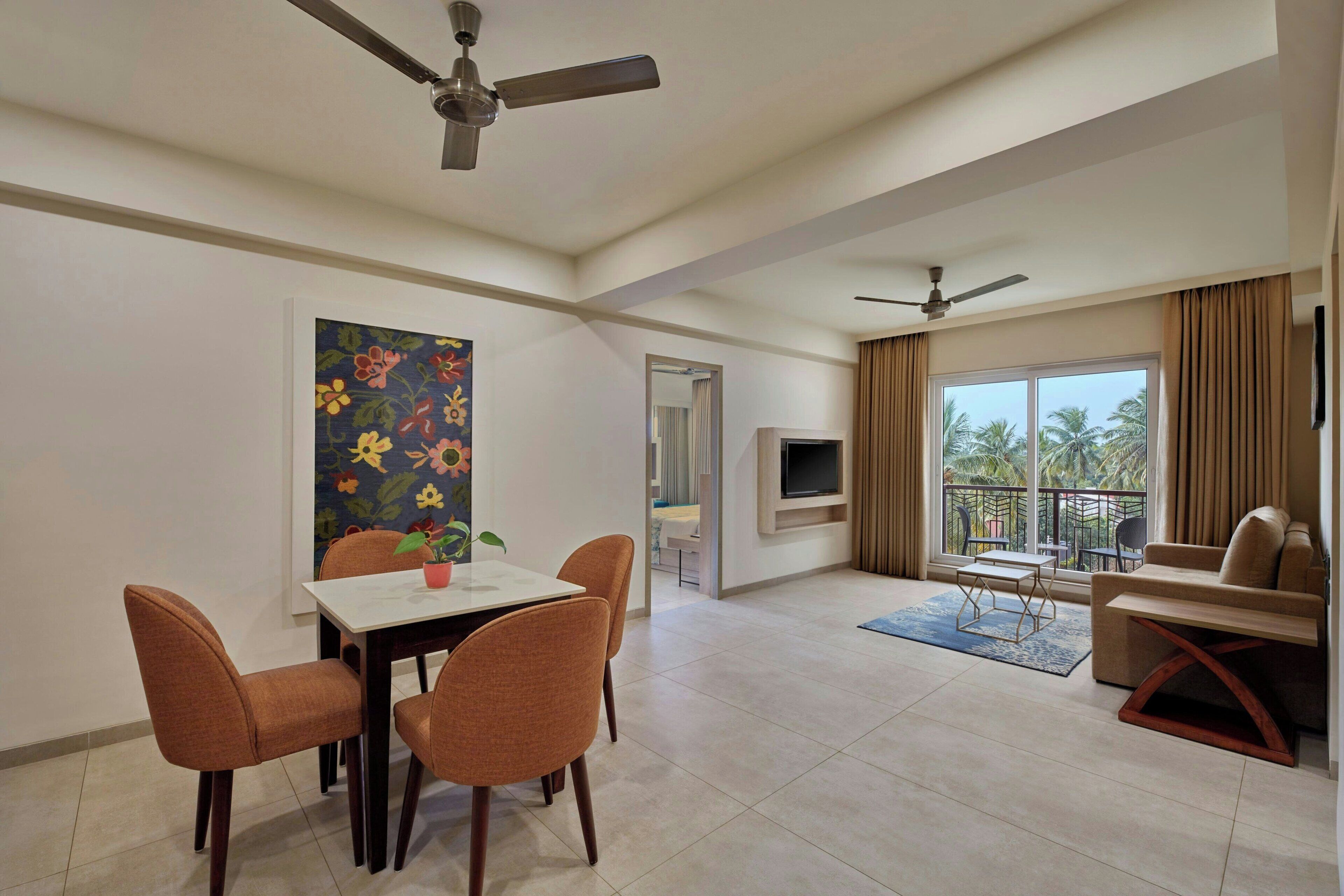 Suite, 1 Queen Bed (View) | Living room | 42-inch LED TV with cable channels, TV