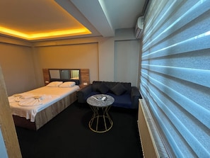 Superior Room | Minibar, in-room safe, desk, laptop workspace