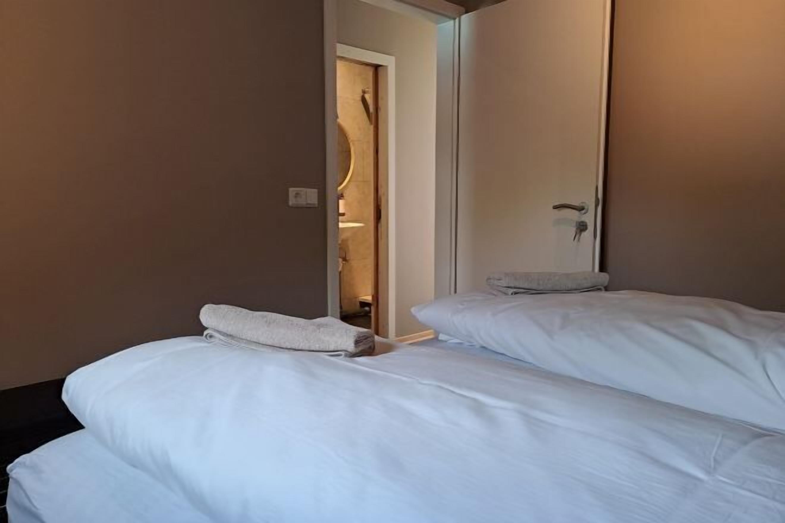 Desk, laptop workspace, free WiFi, bed sheets