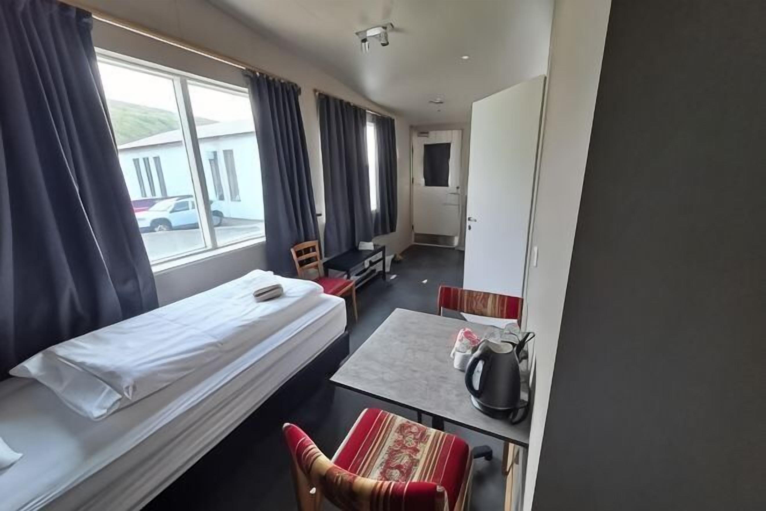 Desk, laptop workspace, free WiFi, bed sheets