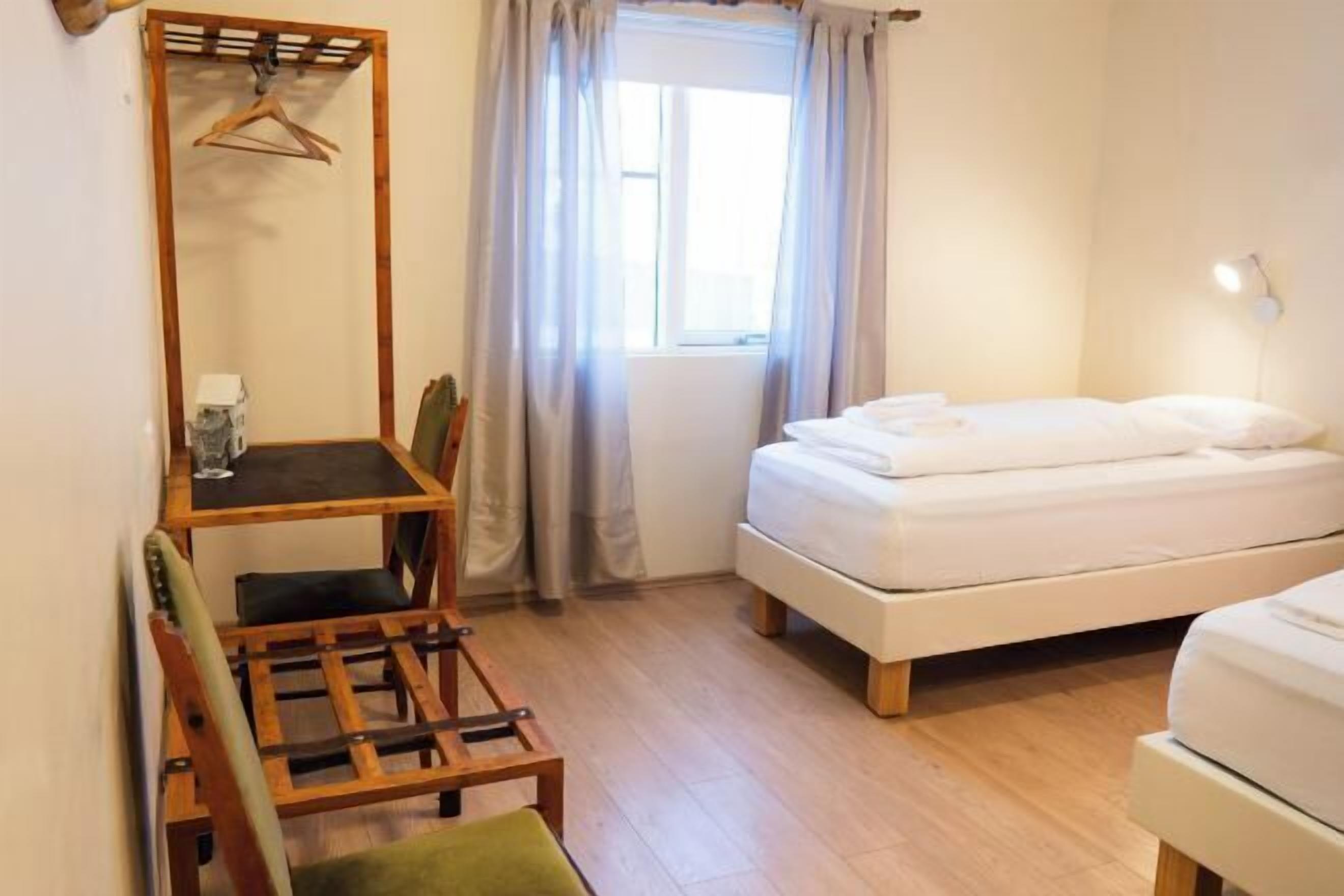 Desk, laptop workspace, free WiFi, bed sheets