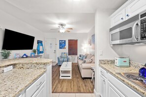 Fridge, stovetop, dishwasher, coffee/tea maker