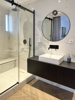 Shower, hair dryer, towels, soap
