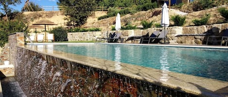 Seasonal outdoor pool, pool loungers