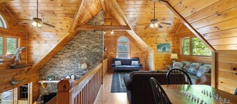 Ideal for large families, this riverfront gem boasts a dock, firepit, hot tub, basketball court, and a pool table for endless fun. Pet Friendly and WiFi