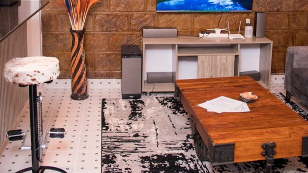 Deluxe Apartment, 1 Bedroom | Living area | 24-inch flat-screen TV with digital channels, TV - Pioneer Luxe Apartments by CHH (Eldoret)