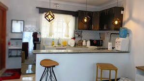 Deluxe Apartment, 1 Bedroom | Private kitchen | Fridge, microwave, oven, stovetop - Pioneer Luxe Apartments by CHH (Eldoret)