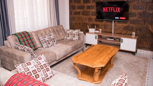 Comfort Apartment | Living area | 24-inch flat-screen TV with digital channels, TV - Pioneer Luxe Apartments by CHH (Eldoret)