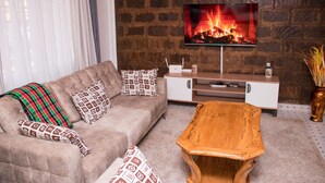 Comfort Apartment | Living area | 24-inch flat-screen TV with digital channels, TV - Pioneer Luxe Apartments by CHH (Eldoret)