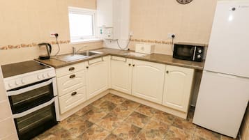 Fridge, electric kettle, toaster, cookware/dishes/utensils