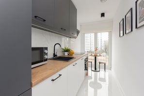 Apartment, 2 Bedrooms, Balcony | Private kitchen | Microwave, dishwasher, electric kettle