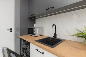 Apartment, 2 Bedrooms, Balcony | Private kitchen | Microwave, dishwasher, electric kettle