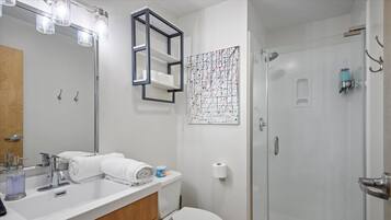 Shower, hair dryer, towels, shampoo