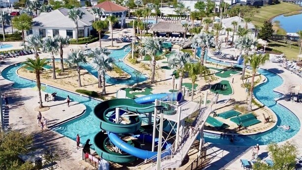 A resort with multiple swimming pools, water slides, and palm trees. - Spacious Home With Fun Decore And Game Room-4544tb 8 Bedroom Home by RedAwning (Kissimmee)