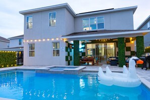 Outdoor pool, a heated pool - Epic Themes | Pool/Hot Tub | Theater & Game Room (Reunion)