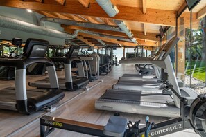 A gym with multiple treadmills, stationary bikes, and rowing machines. - Estival Park Almaris (Vila-Seca)