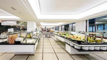 A buffet area with multiple food stations and a central serving counter.