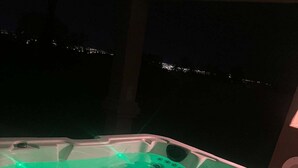 A hot tub with a green light.
