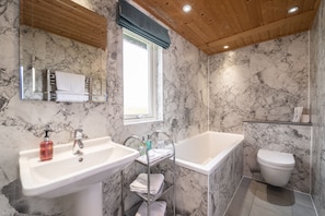 Bathtub, hair dryer, towels