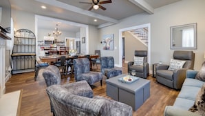 A spacious living room with a dining area, a kitchen, and a staircase leading to another level. - The Sterling- walk to everything Luray has to offer! Chef available (Luray)