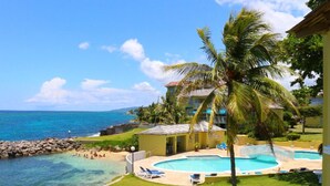 A resort with a pool, beach, and ocean view. - Sea Palms Holidays (Tower Isle)
