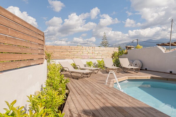 Seasonal outdoor pool, pool umbrellas, pool loungers