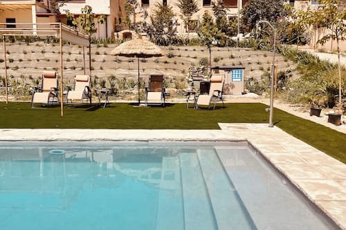 Seasonal outdoor pool, open 11:00 AM to 8:30 PM, pool umbrellas