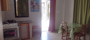 Fridge, cookware/dishes/utensils, dining tables