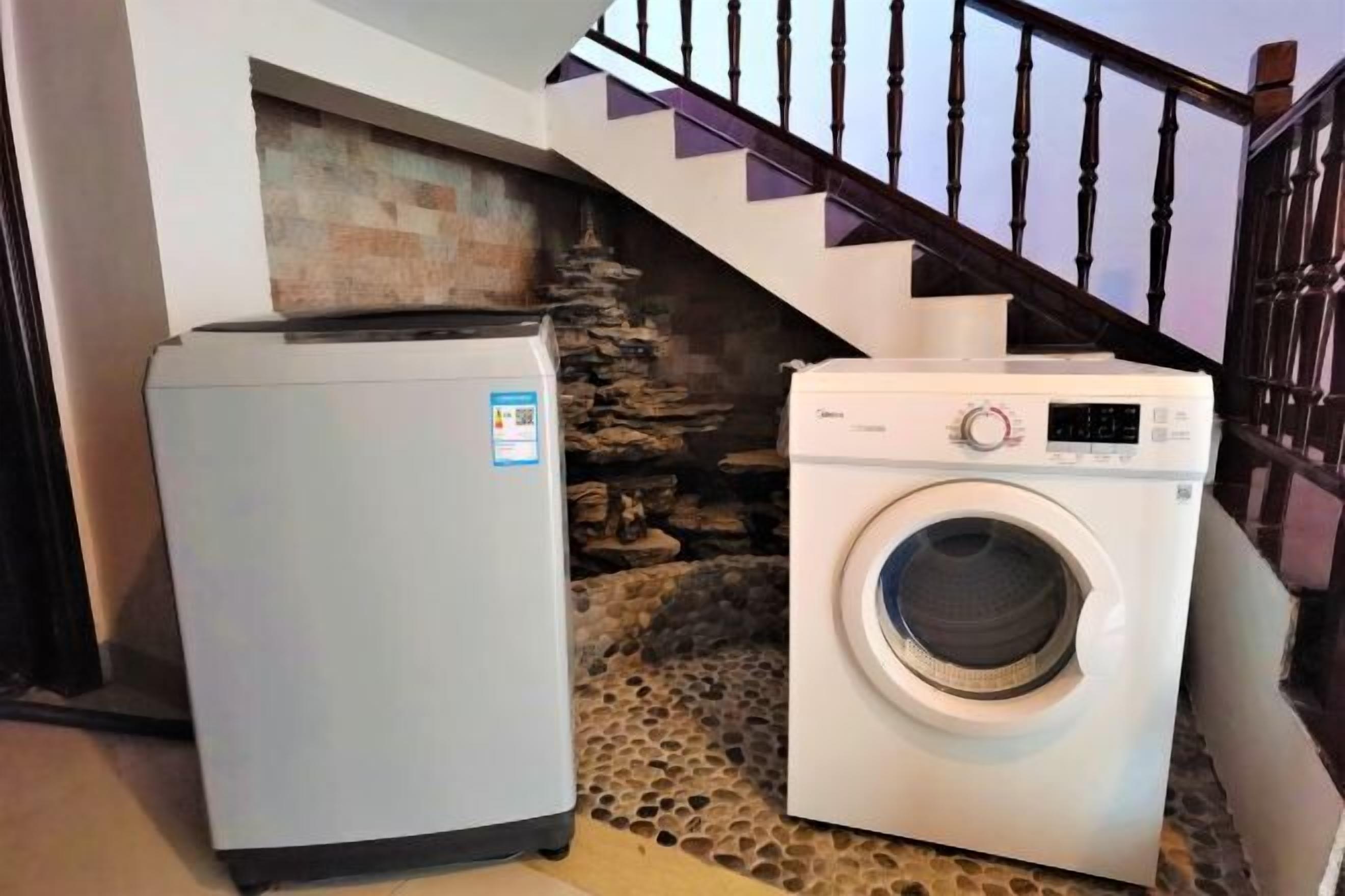 A compact laundry area with a washing machine and a refrigerator.