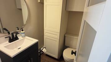 Shower, hair dryer, towels, shampoo