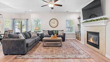 Smart TV, fireplace, books, printers