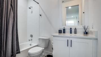 Townhome | Bathroom | Shower, free toiletries, towels, soap