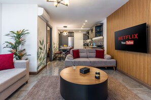 Luksus-lejlighed - 1 soveværelse - adgang til pool | Opholdsområde | 25-tommers tv med kabelkanaler