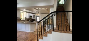 Enjoy cooking in this well-equipped kitchen with a large island and stainless steel range hood.