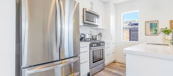 Dog-friendly duplex with washer/dryer, two full kitchens, & large backyard